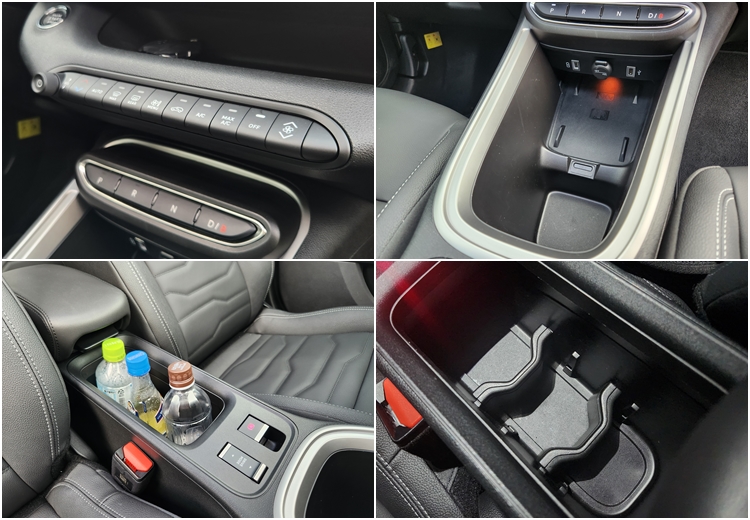 지프 어벤저 공조기 조작 토글 스위치와 스마트폰 무선충전 패드, 컵홀더 겸 수납공간.  / 제갈민 기자