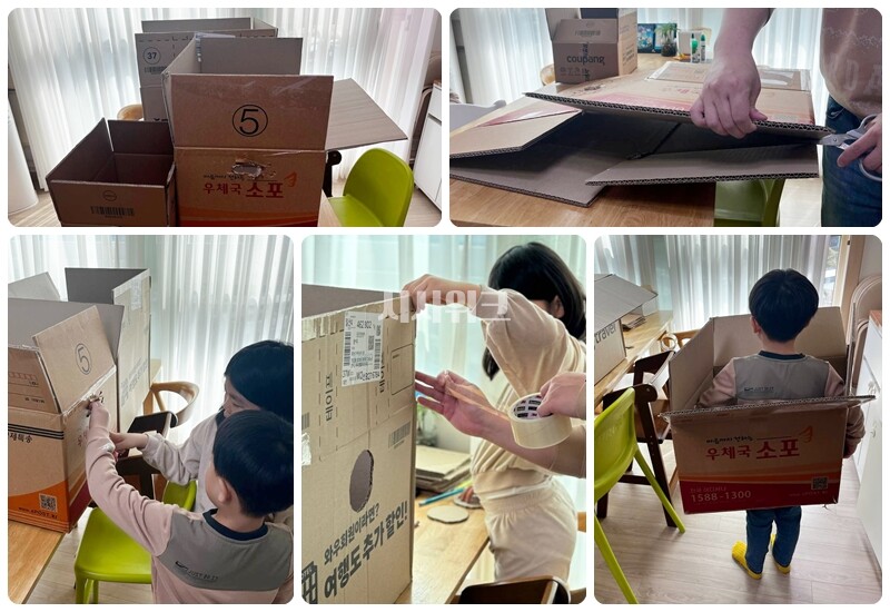 아이들과 함께 박스의 어디를 자르고 어디를 붙일 지, 또 어디에 구멍을 낼지 토론하며 기차를 만들어보고 있다. / 권정두 기자
